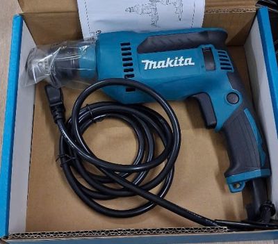 Máy khoan 630W-13mm Makita DP4020